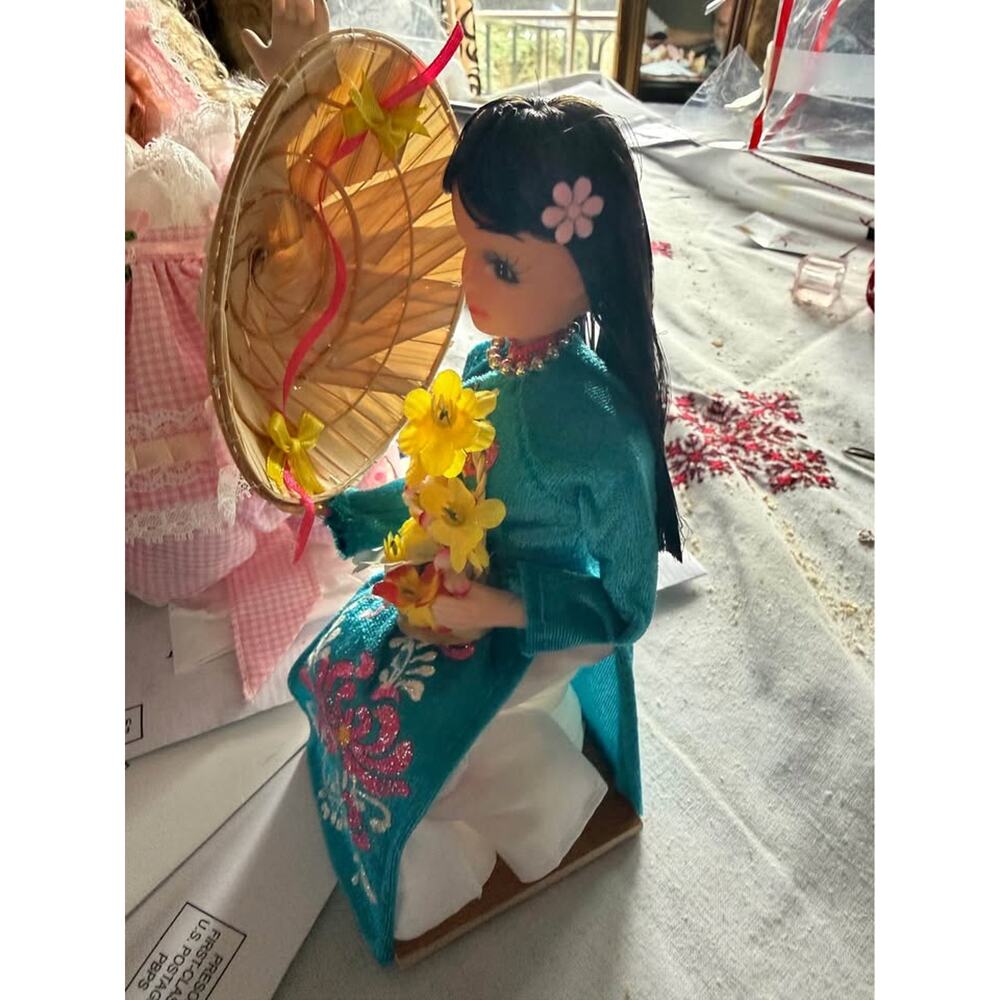 Vintage Collectible Representing a Vietnamese Girl in Traditional Attire.